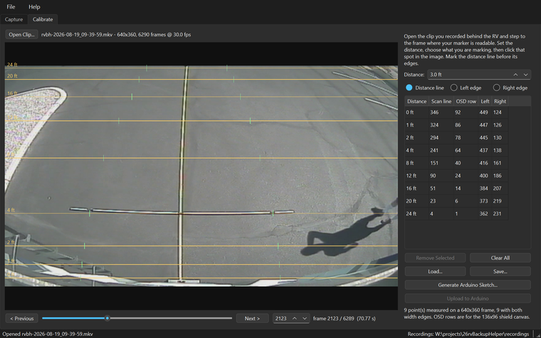 The RV Backup Helper Calibrate tab: a recorded frame of the driveway behind an RV, amber distance guides labelled 0 to 24 feet, green width ticks, and a table of the measured scan lines